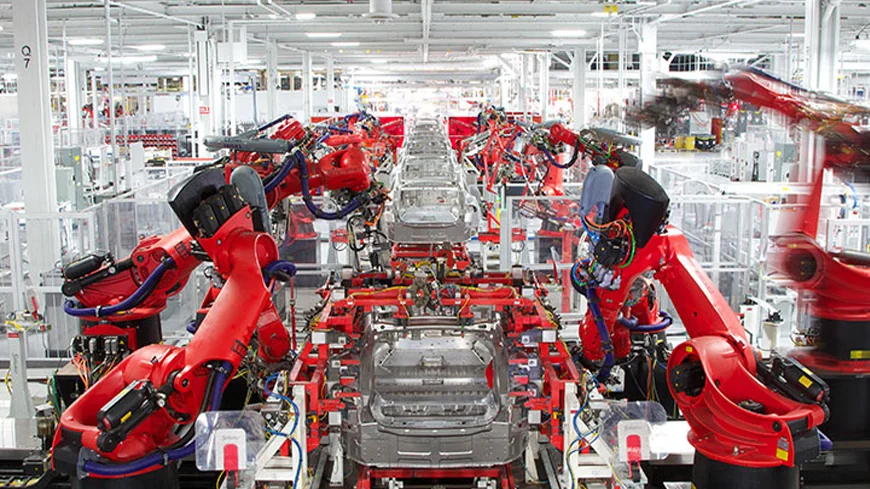 Engineer working with modern industrial automation equipment