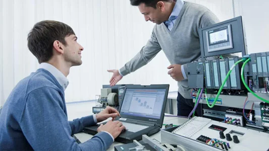 Engineer working on electronic and automation equipment